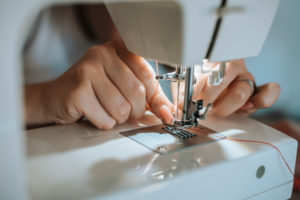 Woman sewing face mask for corona covid pandemic with sewing machine, Woman sewing face mask for corona covid pandemic with sewing machine,